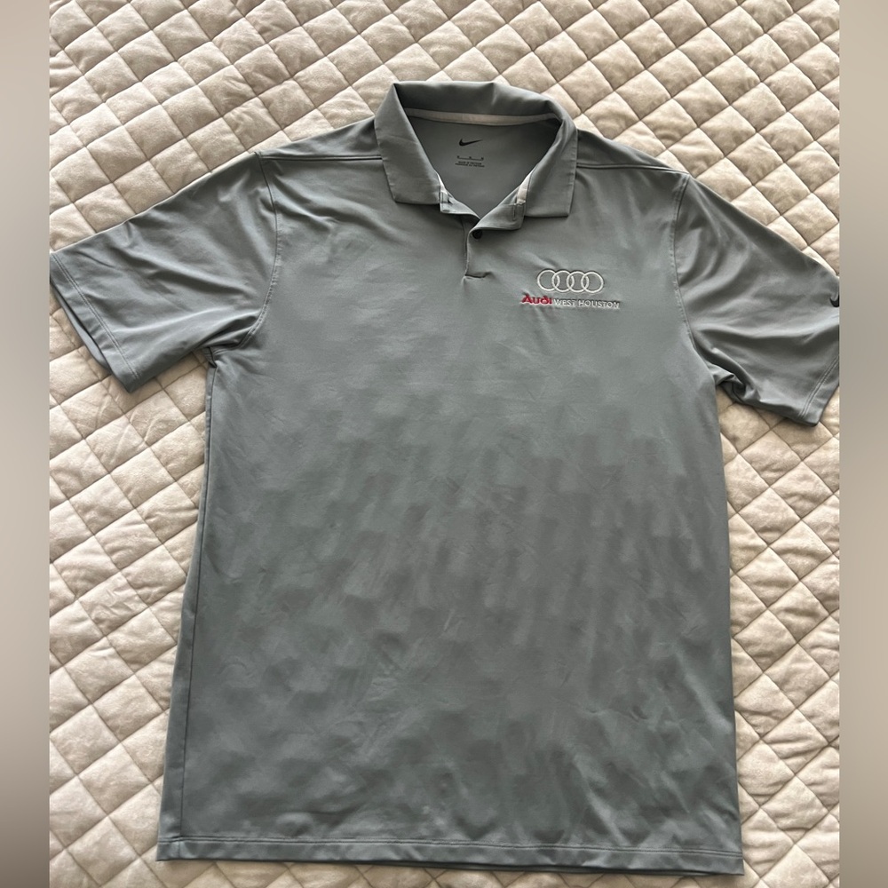 Audi polo gray Nike shirt.